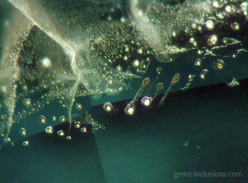 glass inclusion bubbles striations loupe view